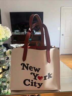 Coach Cream Tote with Brown Handles and Black Graphic